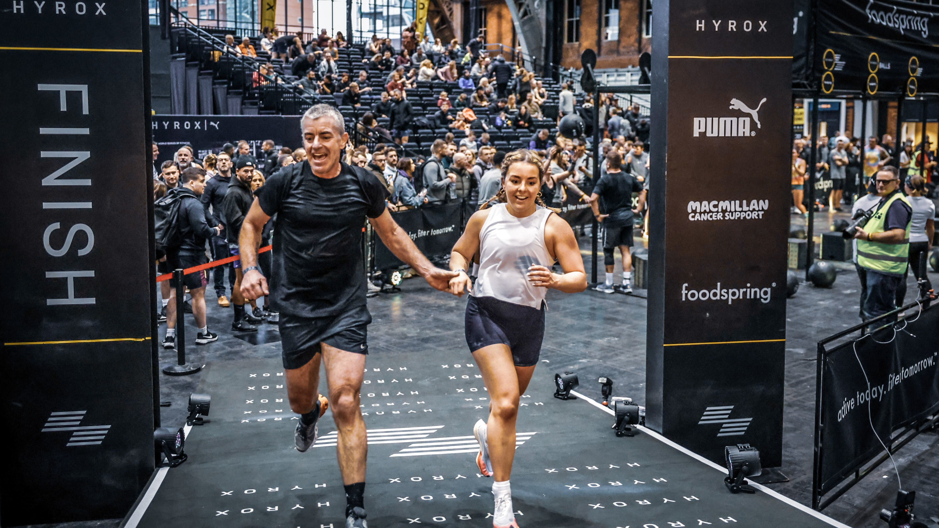 Ell&euml; Bolland and her dad crossing the HYROX finish line